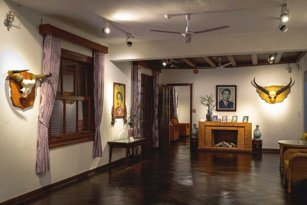 Inside Bao Dai's Palace, museum exhibits showcasing artifacts and historical displays.