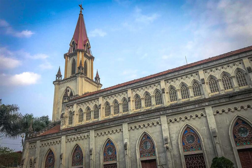 The stone walls and bell tower of Coc Leu Church in the middle of Lao Cai Town