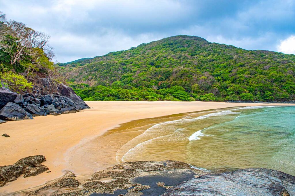 Con Dao in November – A view of Dam Trau Beach under grey clouds, marking the transition between the rainy and dry seasons.