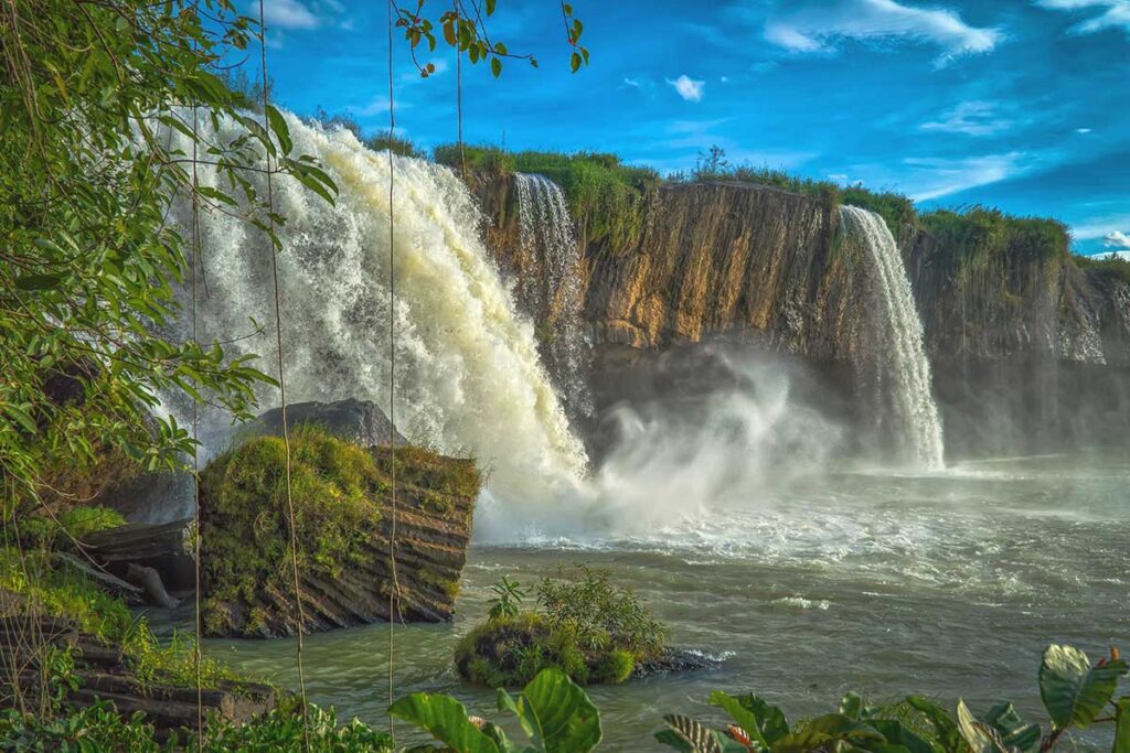 A close-up shot of Dray Nur Waterfall, capturing its strong, rushing waters as they crash into the pool below.