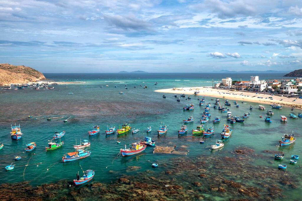 Hai Nam fishing village with lots of fishing boats and beautiful beach