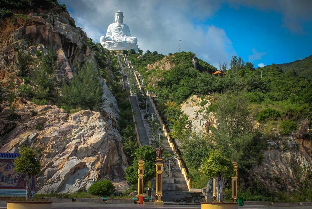 Steep staircase leading up to the 108-meter white Buddha at Ong Nui Temple in Binh Dinh.