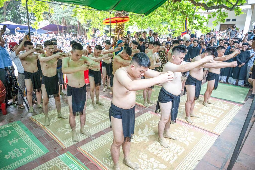 Wrestlers are praying before the Mud ball wrestling festival