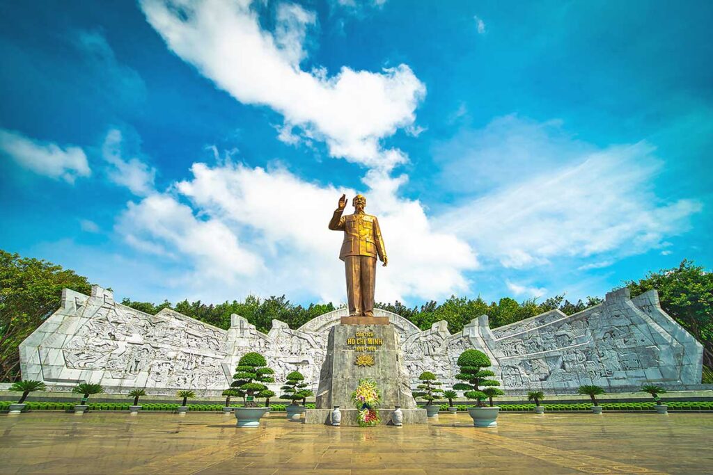 The Ho Chi Minh statue standing prominently in Great Unity Square, a central landmark in Pleiku city.