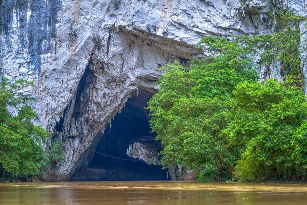 The cave opening of Puong Cave seen from a boat outside the cave in Ba Be National Park