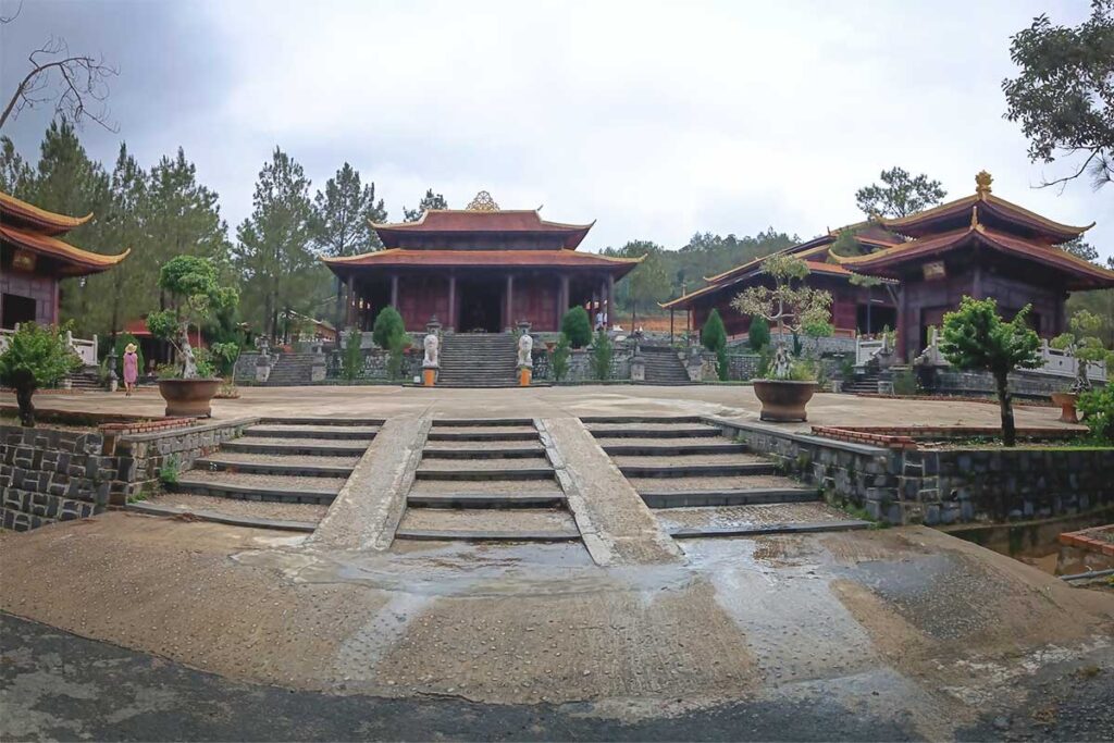 A serene view of Truc Lam Dao Nguyen Zen Monastery, nestled among dense forests, creating a peaceful retreat in nature.