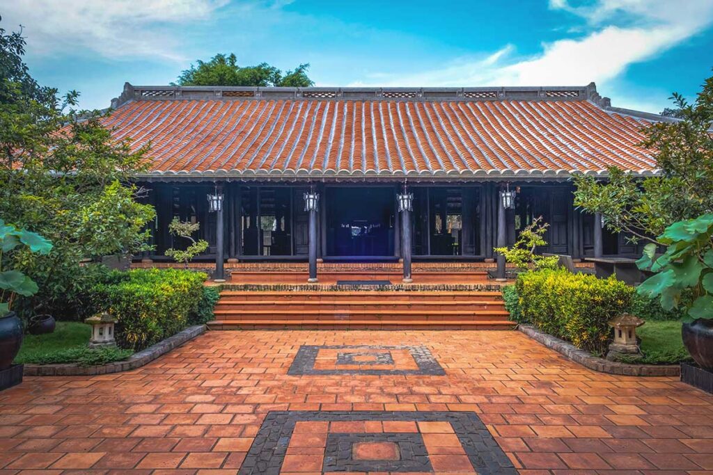 A traditional house at Trung Nguyen Coffee Village, showcasing the architectural heritage of the Central Highlands' ethnic groups.  