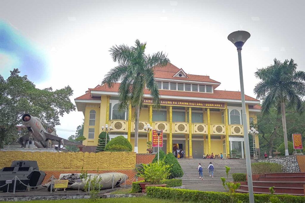 The outside yellow building and military plane displayed of Vietnam Bac Armed Forces Museum in Thai Nguyen city