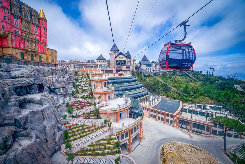 Ba Na Hills cable car arriving at the peak with the castle and French village