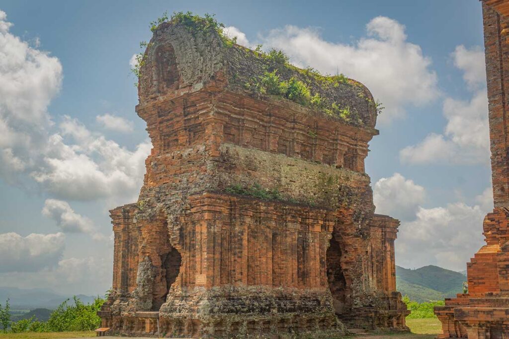 Kosagrha (Fire Tower) at Banh It Cham Towers, weathered Cham brick and barrel-vault roof.