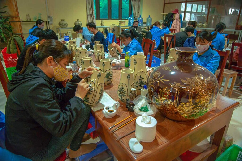 Inside a workshop in Chu Dau Ceramic Village where local woman are painting ceramics by hand