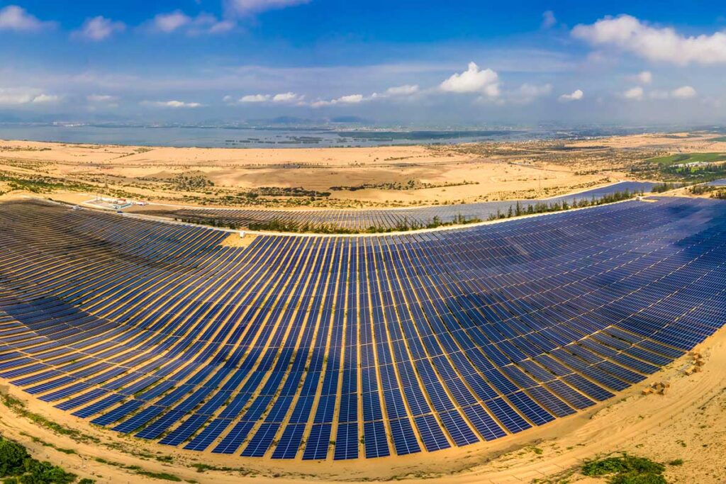 Massive solar farm spread across the sandy terrain of Phuong Mai Peninsula, highlighting how the area combines dunes with renewable energy projects