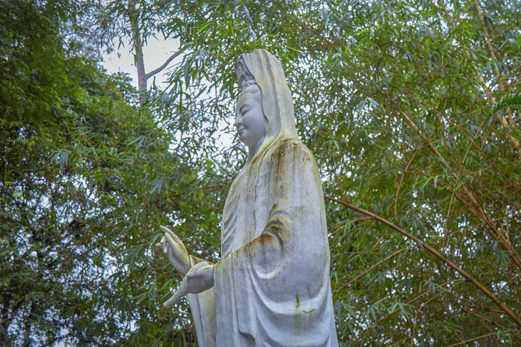 Closeup of Am Bodhisattva statue in the garden of Bao Quoc Temple