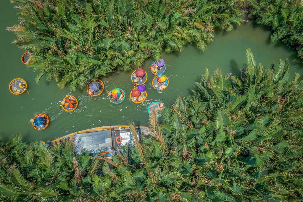 Aerial view of basket boats moving through the coconut forest – unique basket boat ride in Hoi An’s Cam Thanh village.