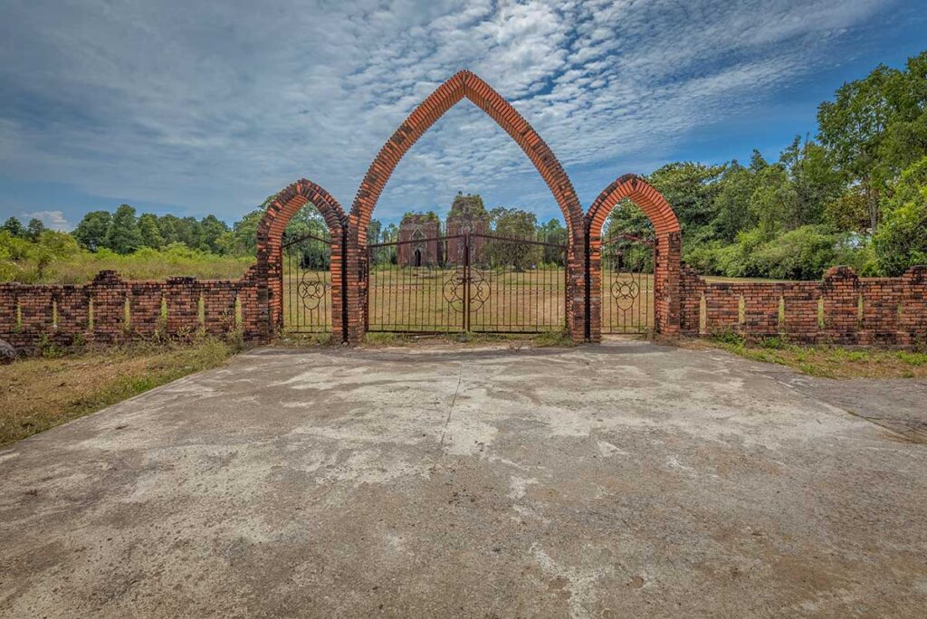Gated entrance to Chien Dan Cham Towers complex in Phu Ninh, Quang Nam
