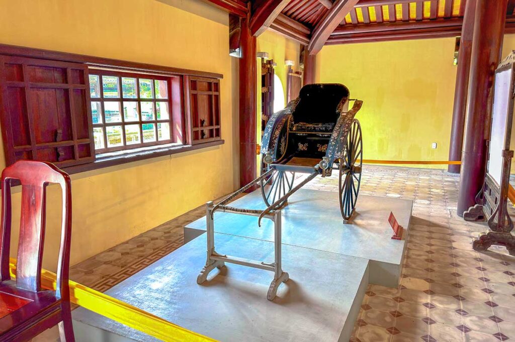 A traditional rickshaw displayed inside Dien Tho Palace in Hue Imperial City