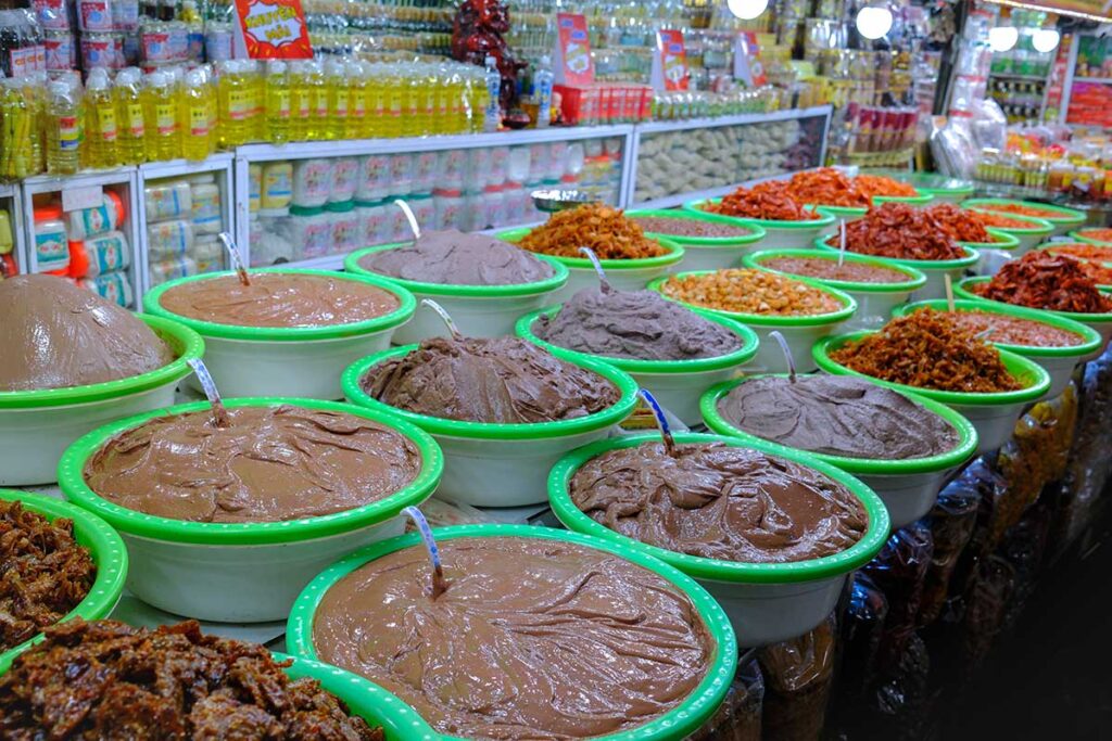 Shrimp paste sold at a market stall inside Dong Ba Market