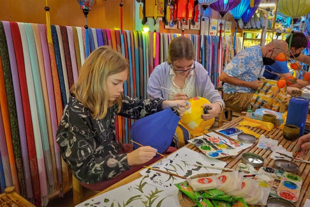 Children and families joining a lantern making class in Hoi An, a fun activity for Hoi An with kids.