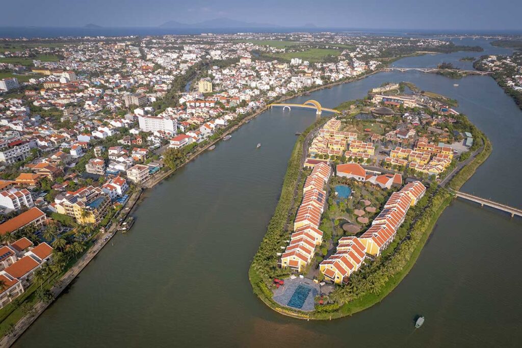 Aerial view of Hoi An Memories Land on Cam Nam Island surrounded by rivers and resorts