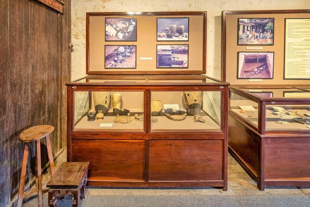 Exhibition of ancient pottery artifacts at Hoi An Museum of Trade Ceramics, with displays of excavated ceramics