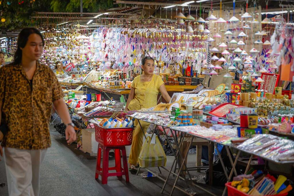 Souvenir stalls with handmade crafts, trinkets, and local products at Hoi An Night Market.