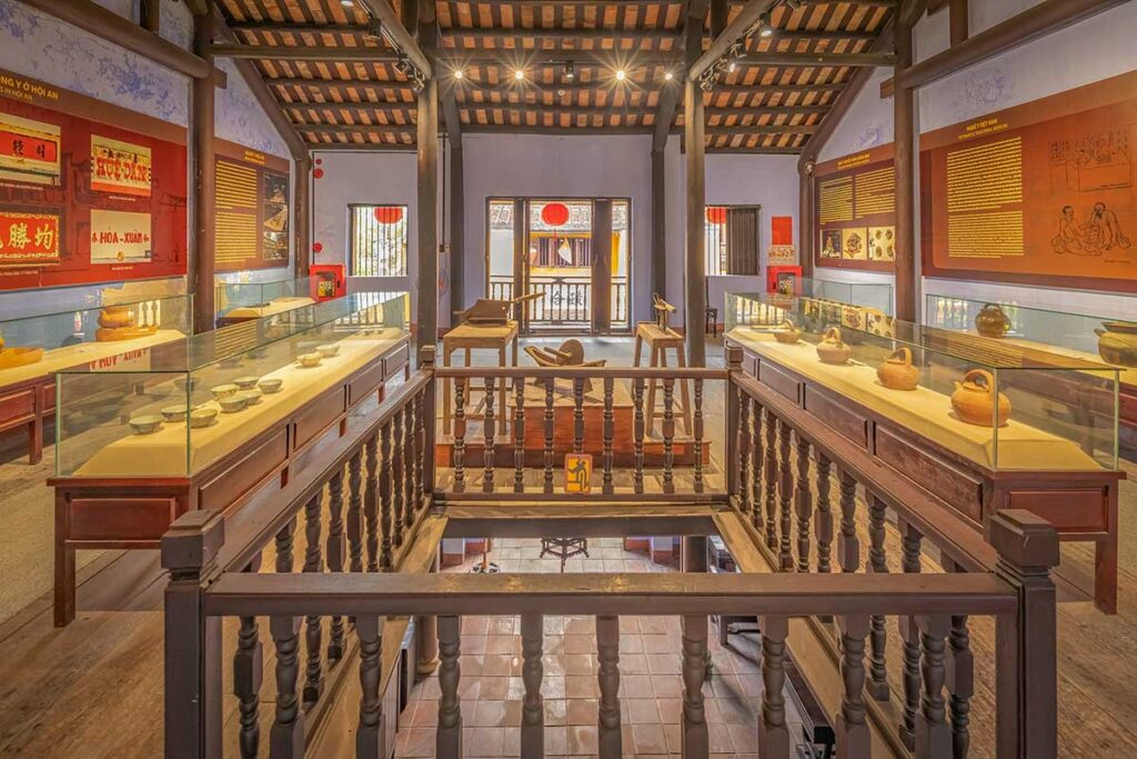 Wide view of the Museum of Traditional Medicine in Hoi An, featuring display cases with ceramics and ancient medical instruments