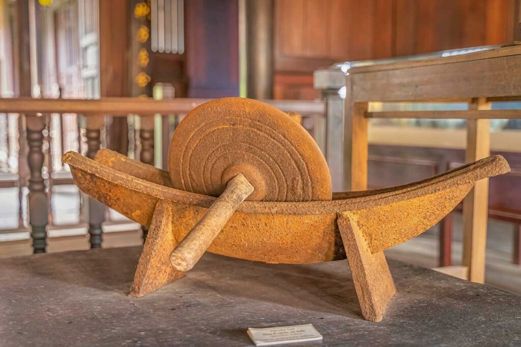 Close-up of an old grinding stone used for preparing herbal remedies at the Museum of Traditional Medicine in Hoi An.