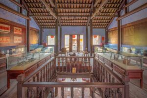 pstairs gallery at the Museum of Traditional Medicine in Hoi An showcasing traditional Vietnamese medical tools, ceramics, and historical information panels