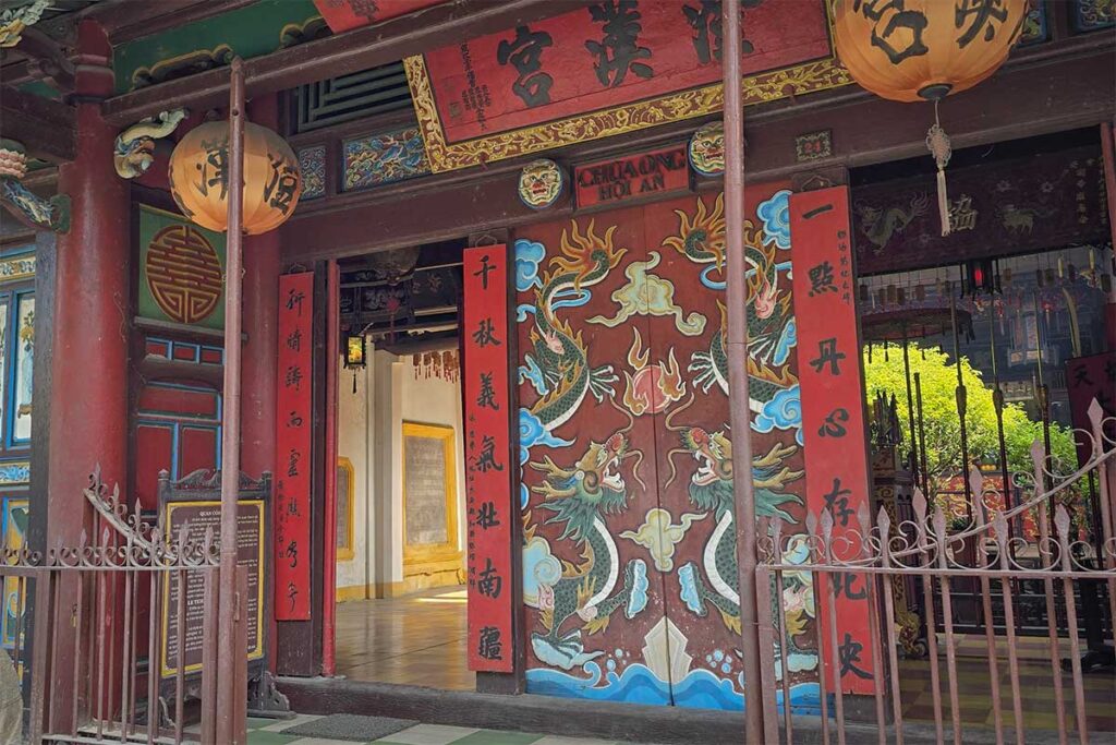 Ornate dragon-painted doorway at Quan Cong Temple in Hoi An Ancient Town