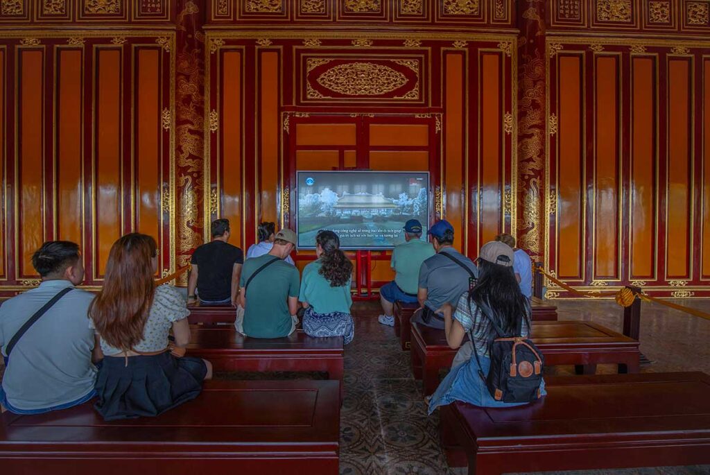 A small screening area showing the history and restoration of Thai Hoa Palace within the palace itself