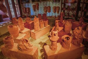 Terracotta art exhibition in Hoi An – Collection of creative clay vases, masks, and sculptures at Thanh Ha Terracotta Park’s indoor gallery.