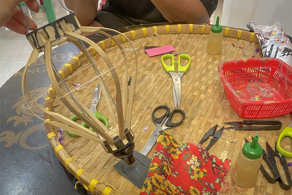 The Lantern Lady lantern class in Hoi An where visitors design and decorate handmade silk lanterns.