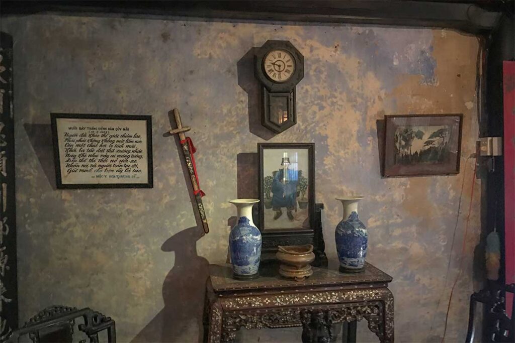 Tran Family Chapel interior with antique altar and porcelain vases in Hoi An, Vietnam