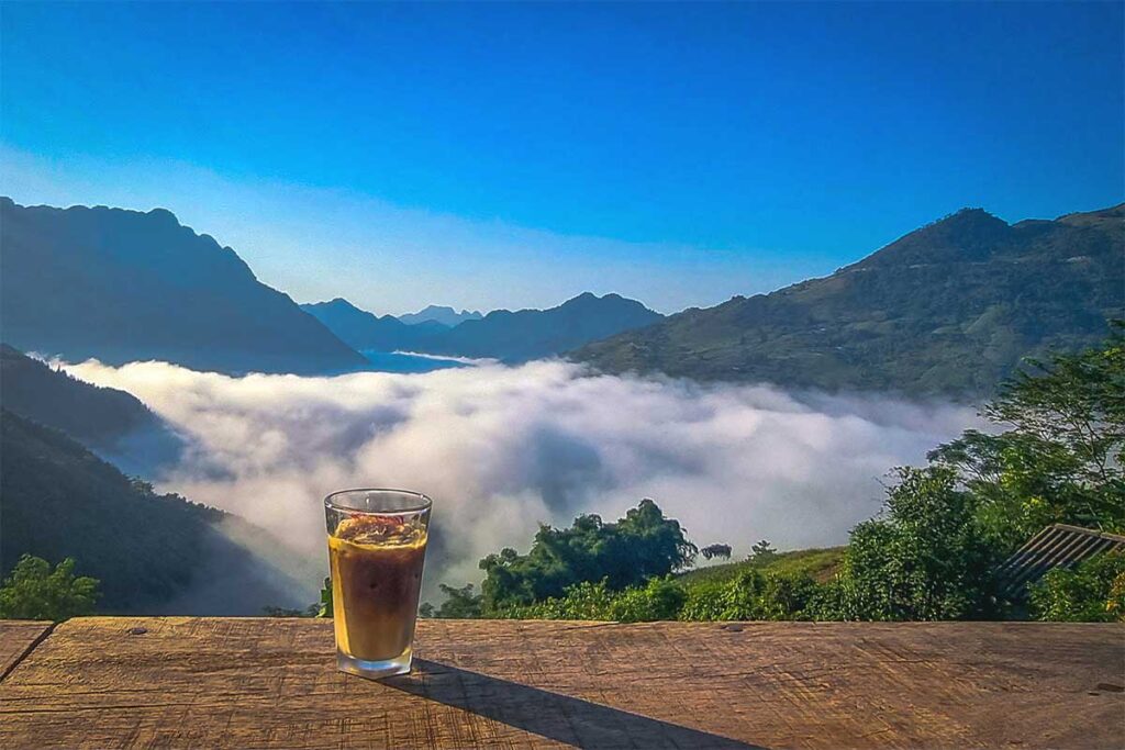 A Vietnamese coffee on a table at a viewpoint cafe on Bac Sum Pass