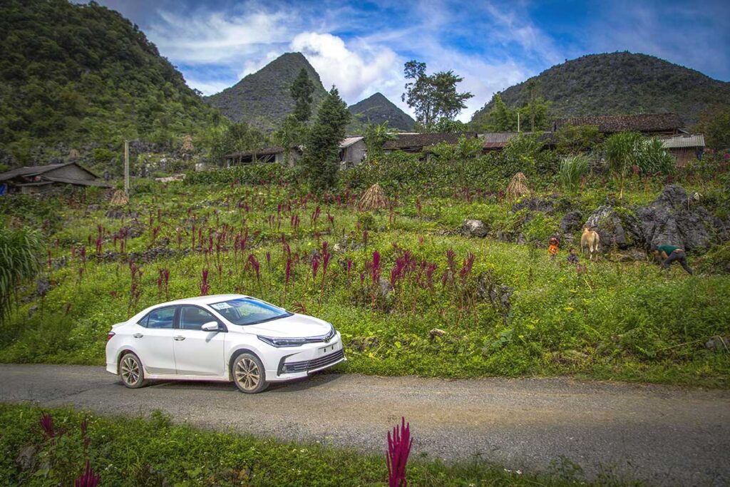 A rented car driving through the mountains of Ha Giang