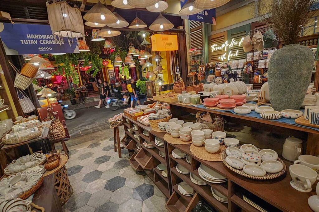 Handmade ceramic bowls, cups, and vases displayed at a souvenir shop in Hoi An Ancient Town — perfect gifts combining traditional and modern Vietnamese design