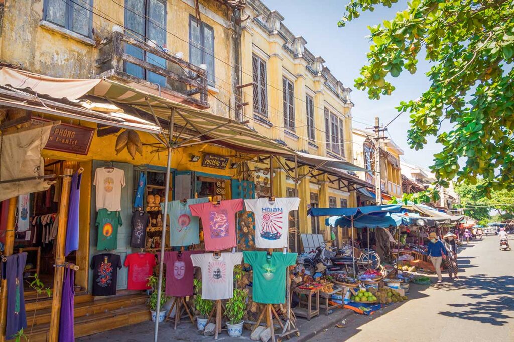 T-shirt souvenir shop in Hoi An Old Town with colorful designs inspired by local culture, a casual and affordable gift for travelers.
