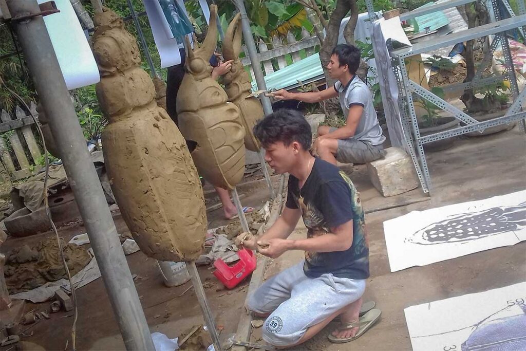 Craftsman shaping bronze using age-old techniques at Phuoc Kieu Bronze Casting Village, a unique traditional village near Hoi An.