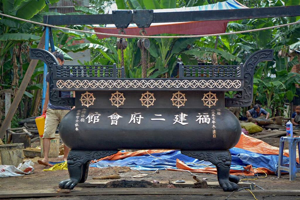 Large bronze censer with Chinese characters being crafted at Phuoc Kieu Bronze Casting Village, Hoi An.