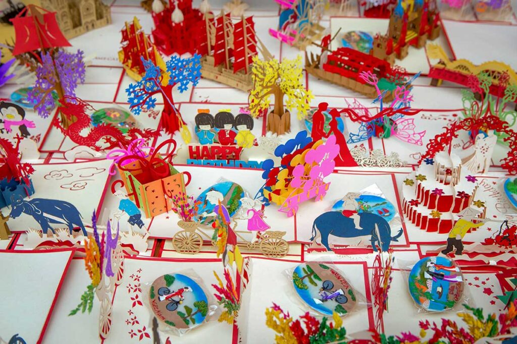 Colorful Vietnamese popup cards with traditional designs and creative 3D patterns — unique souvenirs handmade across Vietnam