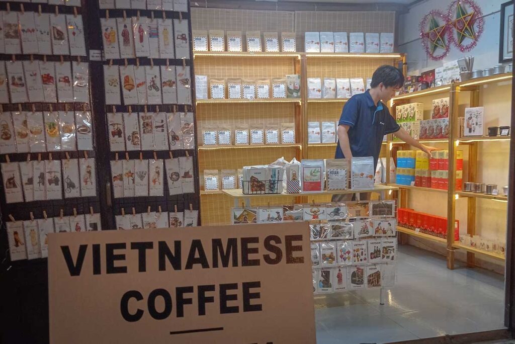 Vietnamese coffee souvenir shop in Hoi An Old Town, selling packaged coffee and postcards — a popular gift for travelers to bring home from Hoi An