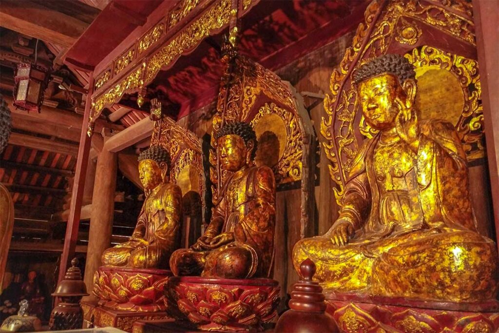 Statues of the Buddhas of the Three Times inside But Thap Pagoda