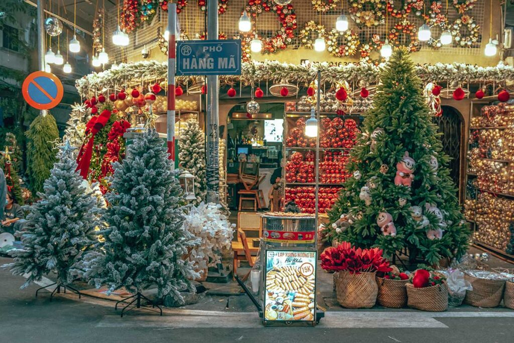A shop on Hang Ma Street in the Old Quarter of Hanoi is selling christmas trees and christmas decorations around the time of christmas in Hanoi