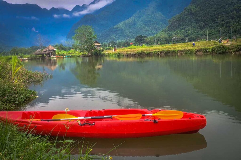 An empty kayak along a local stream in Mai Chau Valley
