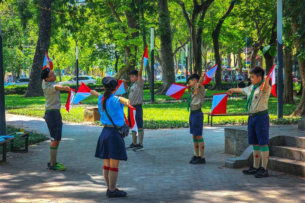 Girl and boy scouts practicing in Lenin Park in Hanoi