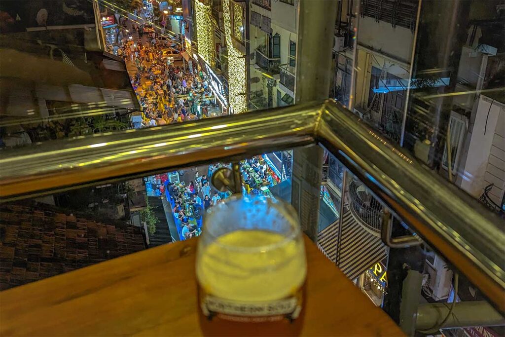 A beer and view from rooftop bar in Hanoi looking down on Hanoi's beer street