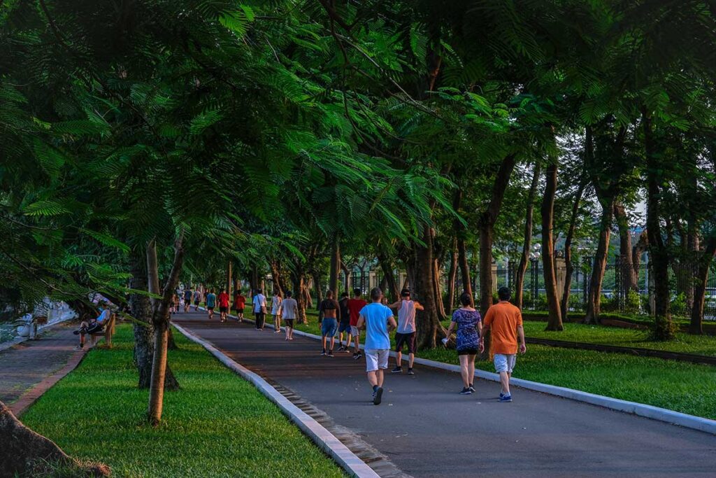 Local Hanoi people are strolling through Thong Nhat Park