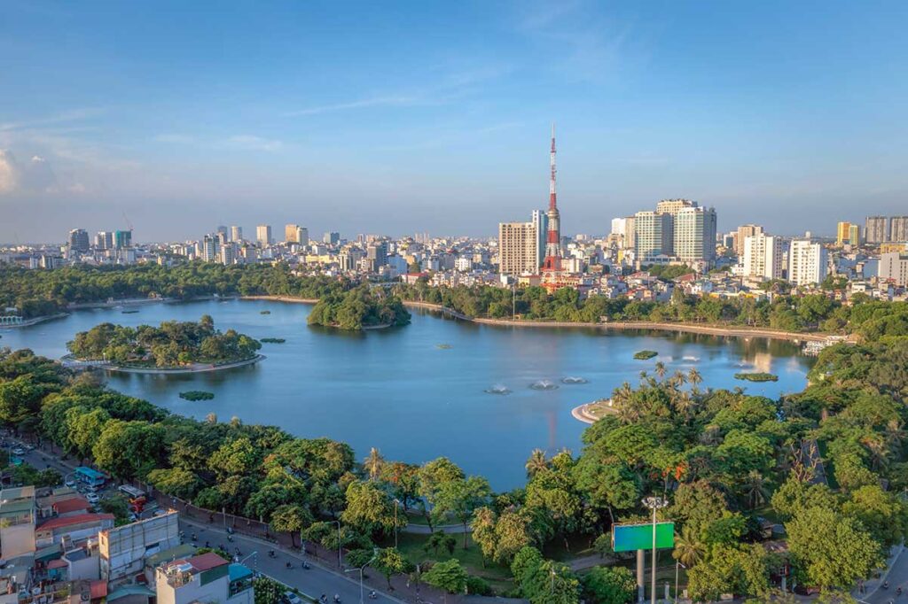 Aerial view of Thong Nhat Park in Hanoi with large lake and trees surrounded by houses and apartment complexes