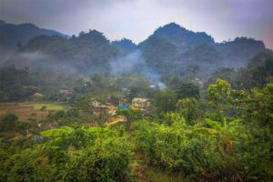 Mountains, jungles and a stilt houses in the distance in Chien Yen Commune of Van Ho District in Son La