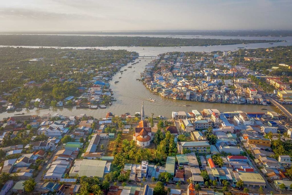 Aerial view of Cai Be town and church – panoramic photo of Cai Be along the Tien River in the Mekong Delta.